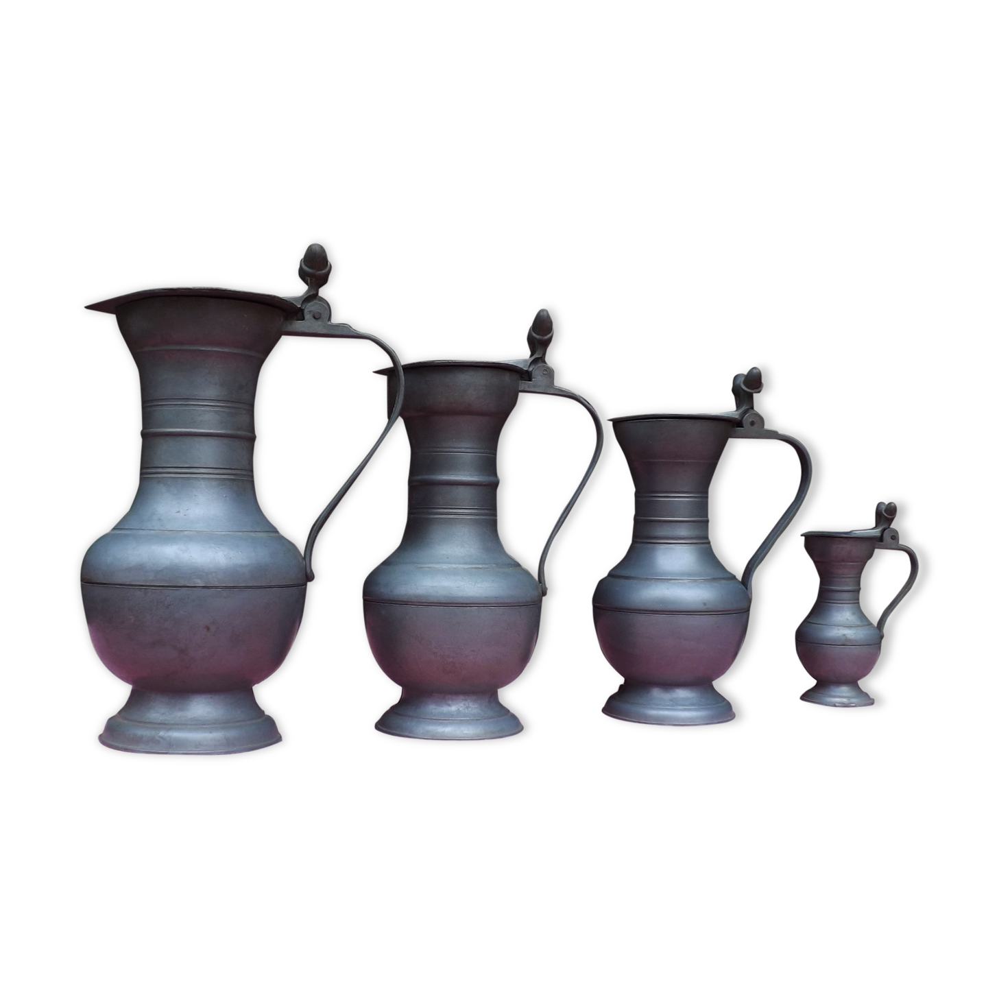 Lot of 4 tin pitchers