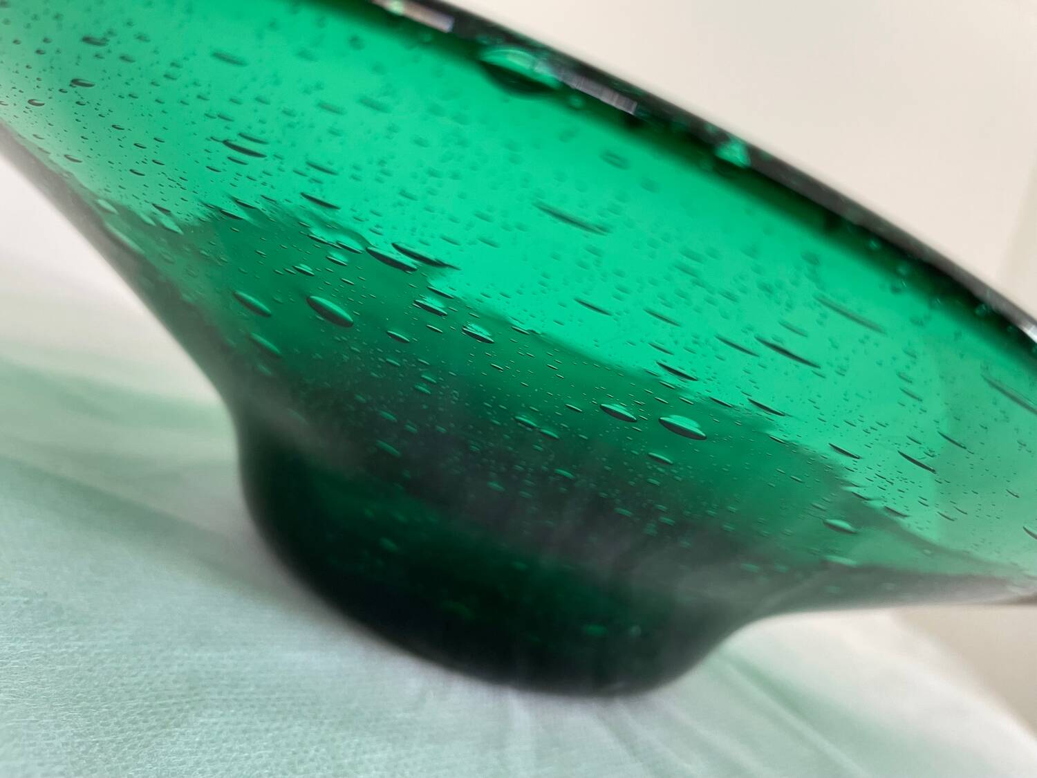 Green glass dish by Max Verboeket