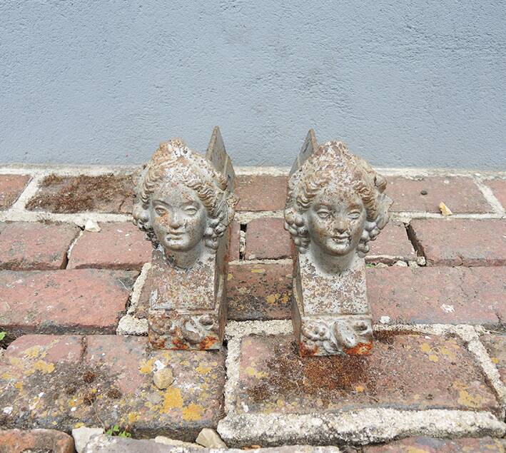 Old women's cast iron chenets with buckles