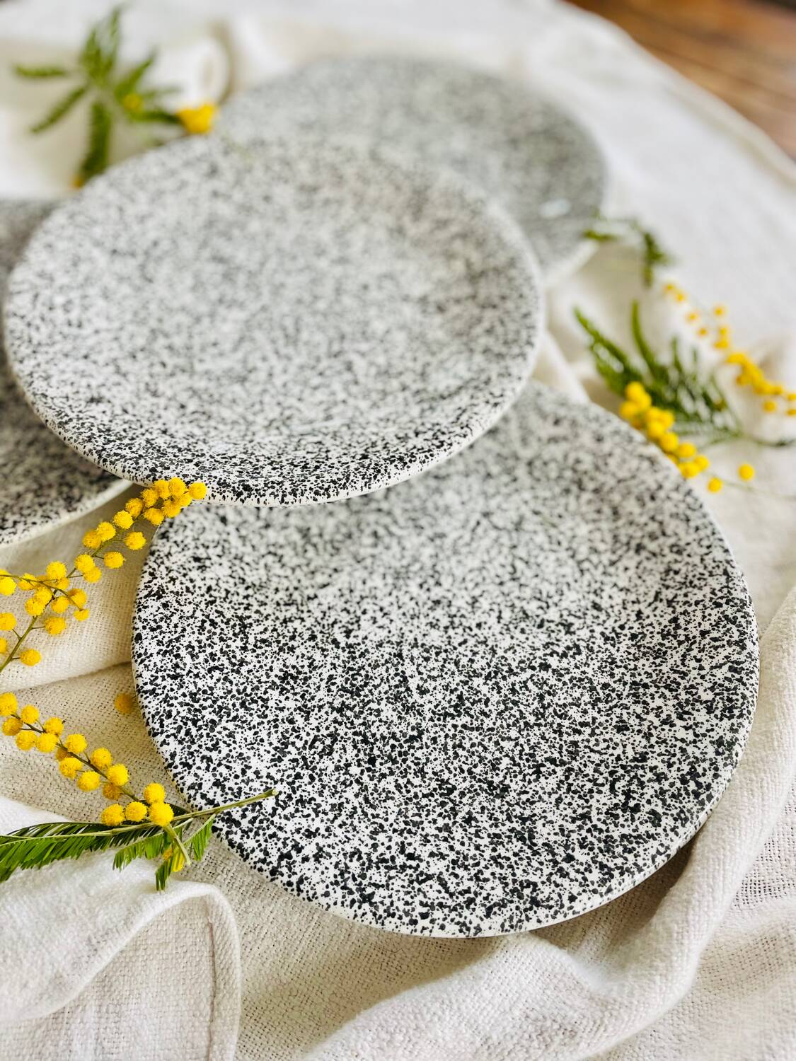 Set of 4 speckled black and white ceramic plates made in Italy