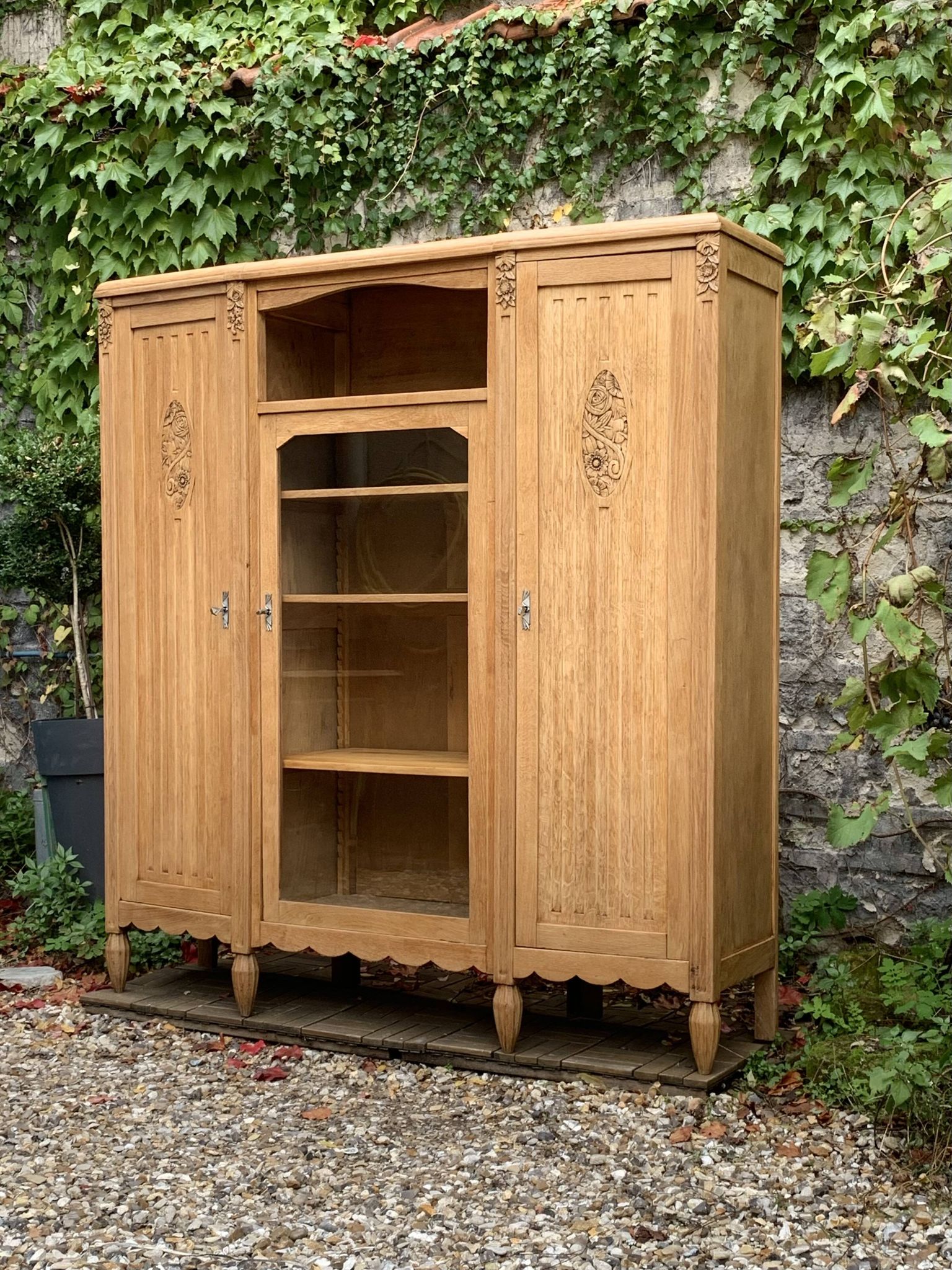 Asymmetrical Art Deco glass-fronted Parisian wardrobe in raw oak, 1930.