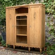 Asymmetrical Art Deco glass-fronted Parisian wardrobe in raw oak, 1930.