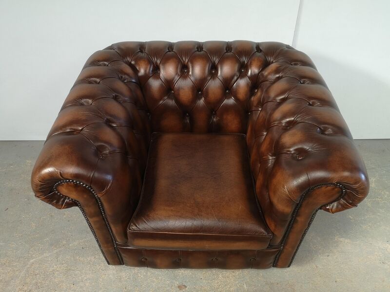 Brown leather chesterfield armchair