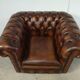 Brown leather chesterfield armchair
