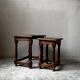 Pair of antique nesting tables made of turned wood.