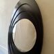 Large oval Italian mirror, modernist, space age design from the 1970s.