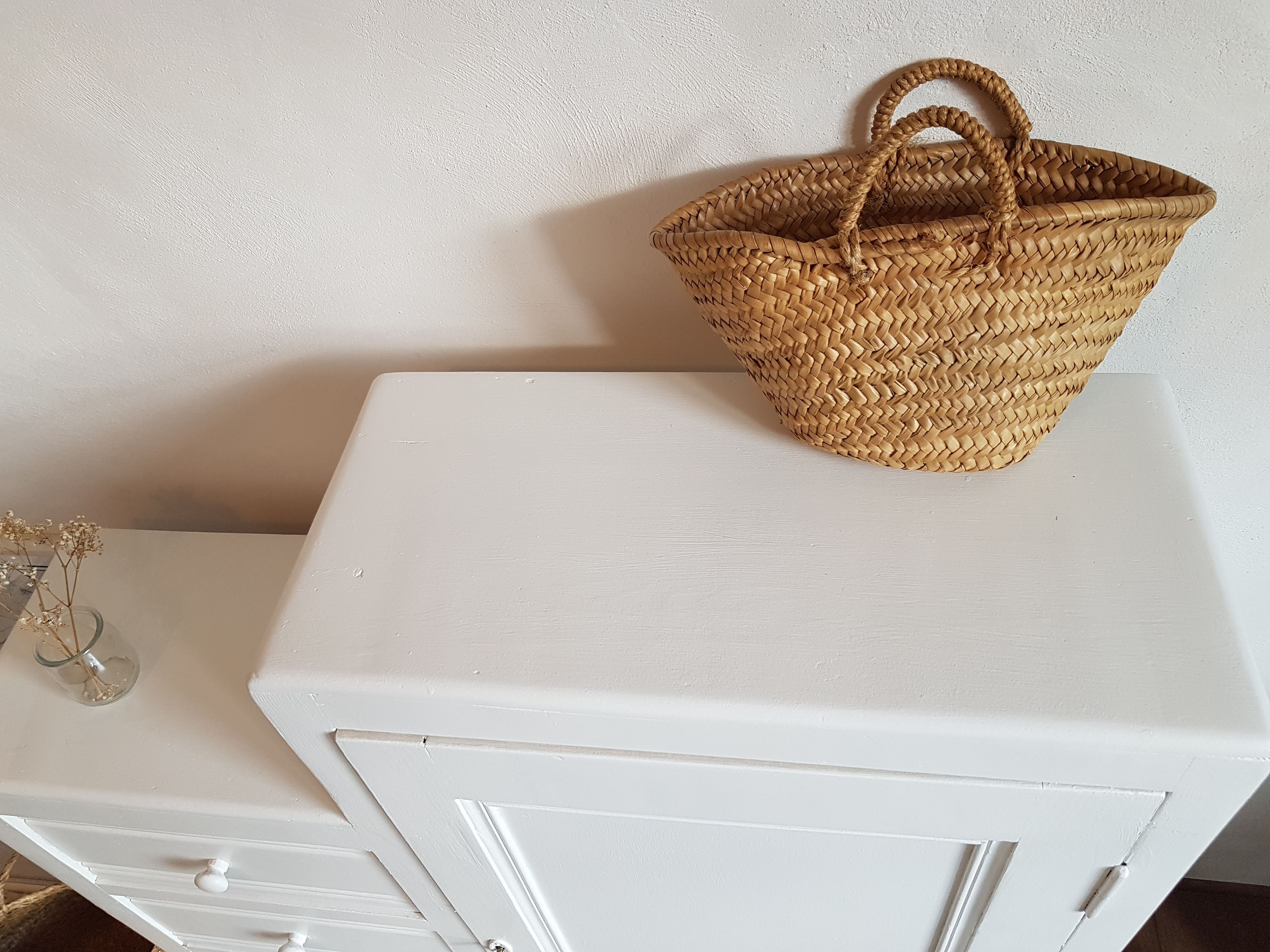 Old white asymmetrical chest of drawers