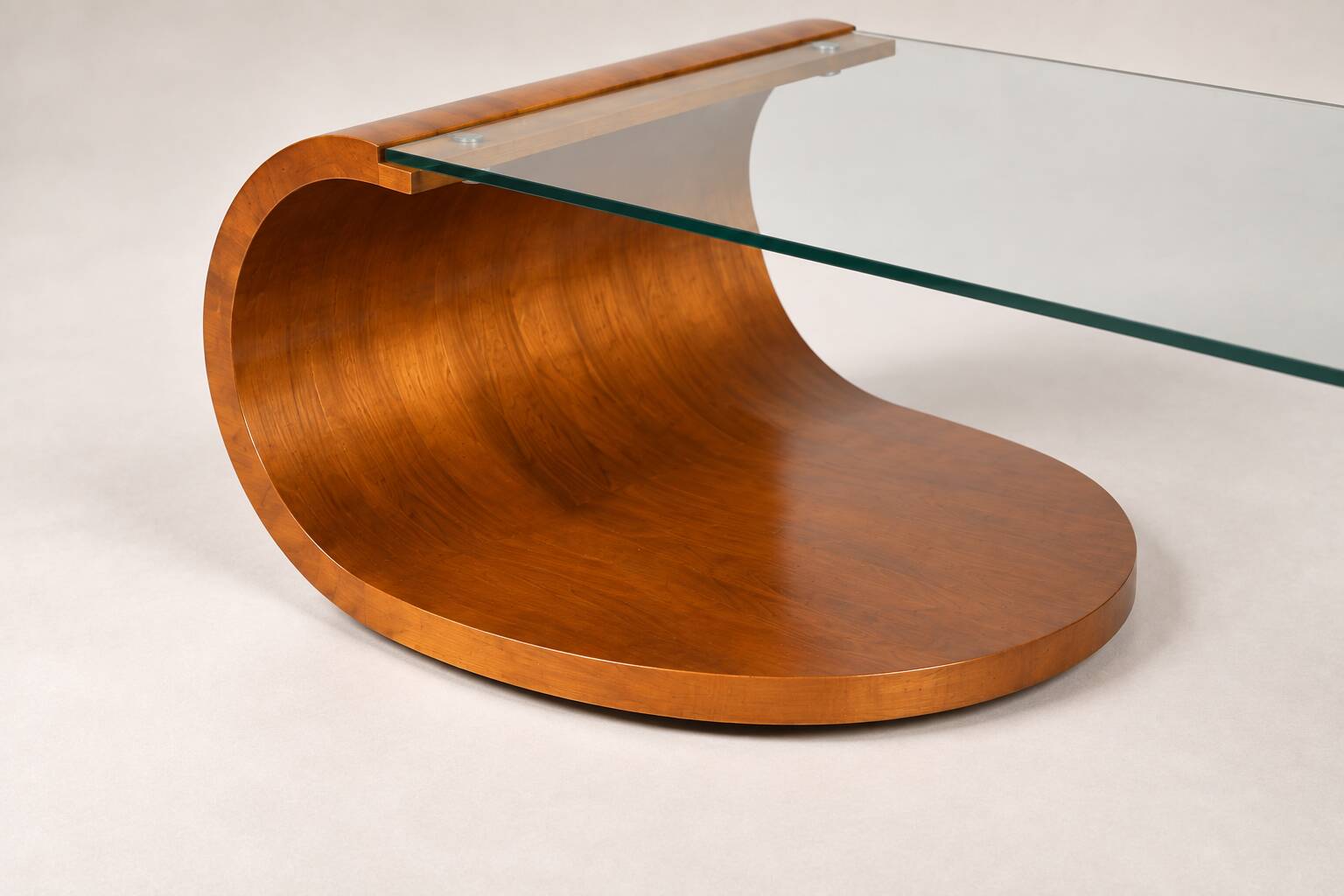 Sculptural coffee table in wood and glass — circa 1970