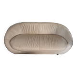 2 seater leather sofa in off-white with a rounded shape