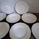 Set of 9 Sarguemines ivory soup plates