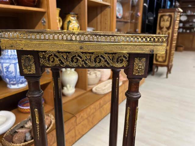 Wooden and brass saddle