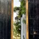 Miroir Empire en bois stuqué et doré, début XIXème siècle