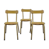 Three wooden and metal bistro chairs