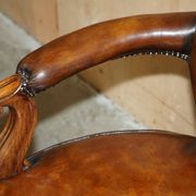 High Victorian leather tête-à-tête canapé with a walnut burr chessboard.