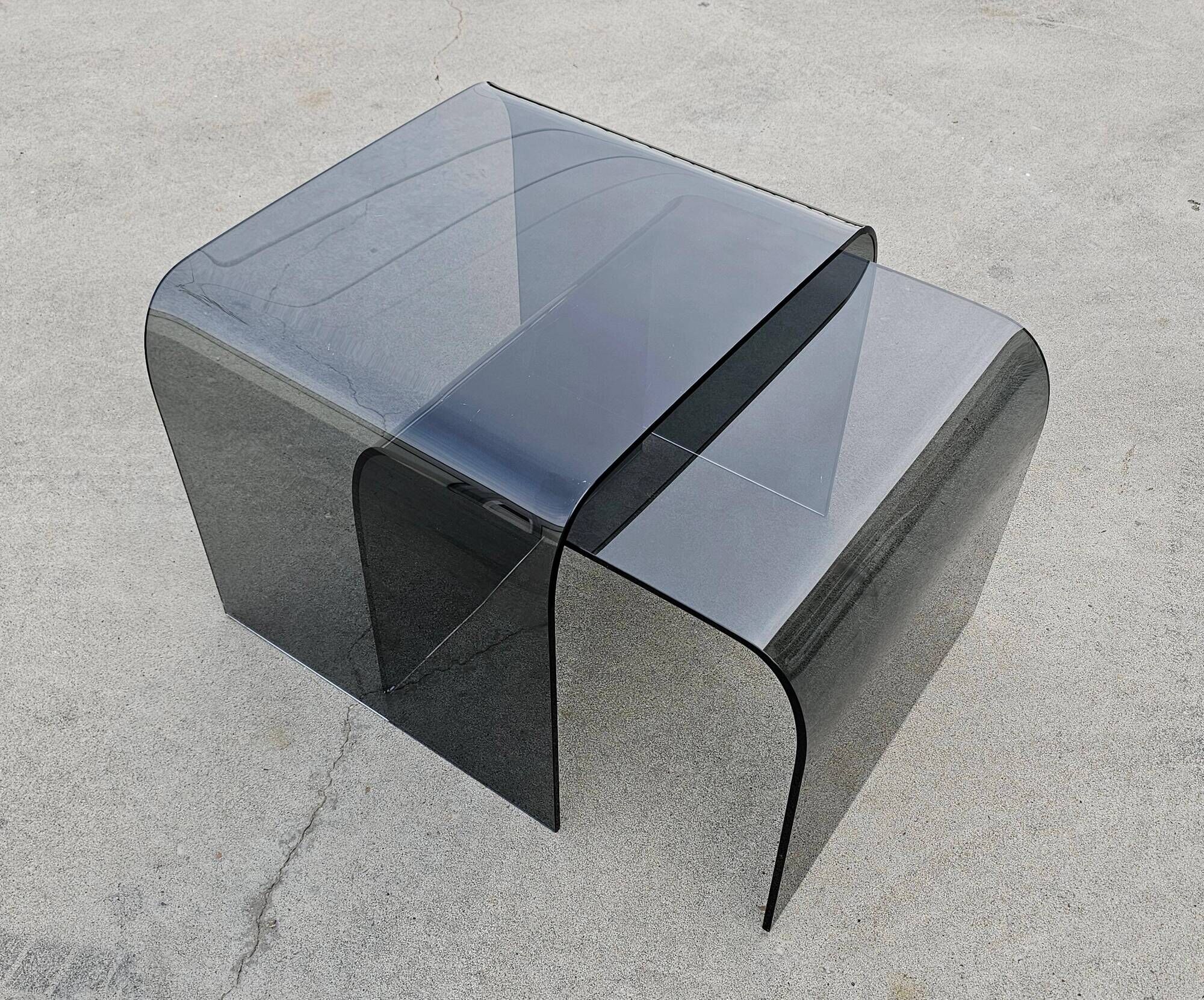 Pair of Waterfall nesting tables in tinted glass attributed to FIAM 1980s.