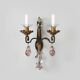 Maison Baguès, pair of wall sconces in wrought iron and gilded sheet metal, crystal pendants.