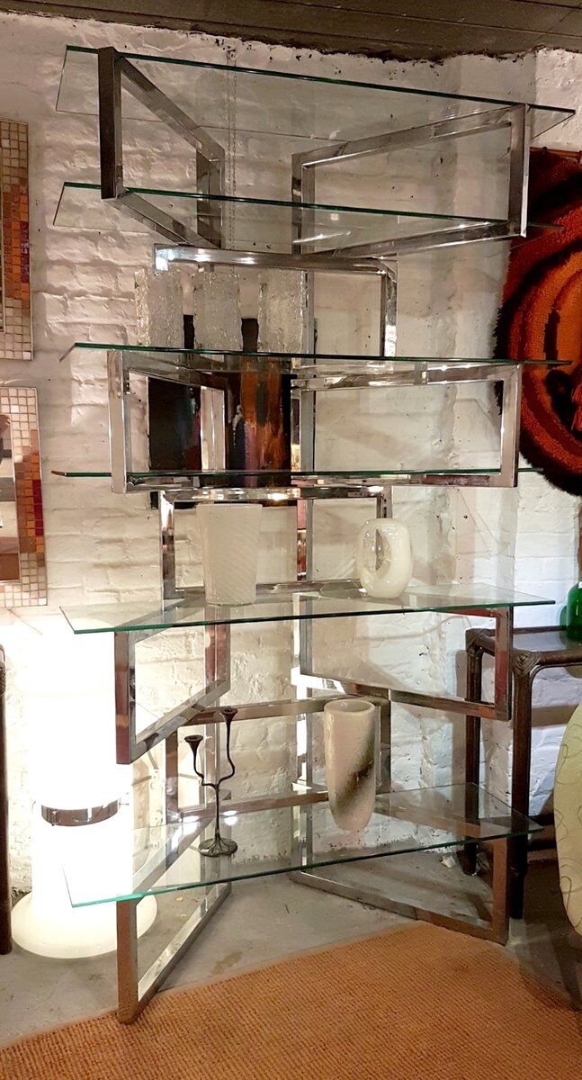 Articulated presentation shelf in chrome and glass. Italy 1970s