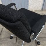 Black mottled fabric and chrome swivel armchair, 1