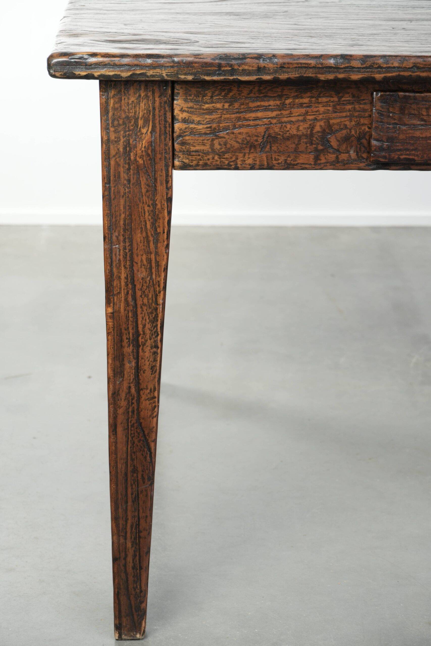 Large rustic dining table made of atmospheric elm wood with fine details