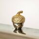 Silver-plated butter dish with a hazelnut knob.