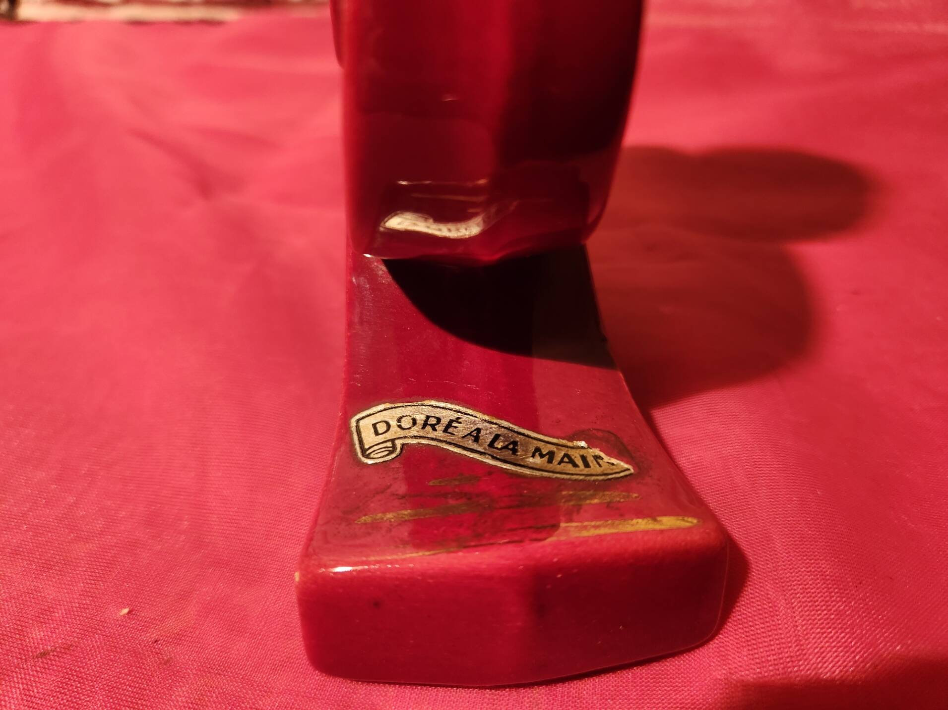 Pair of vintage ceramic candle holders, hand-painted in red and gold.