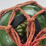 Globe, green glass float and vintage rope