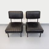Set of 2 vintage modernist armchairs in black faux leather and metal.