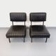 Set of 2 vintage modernist armchairs in black faux leather and metal.