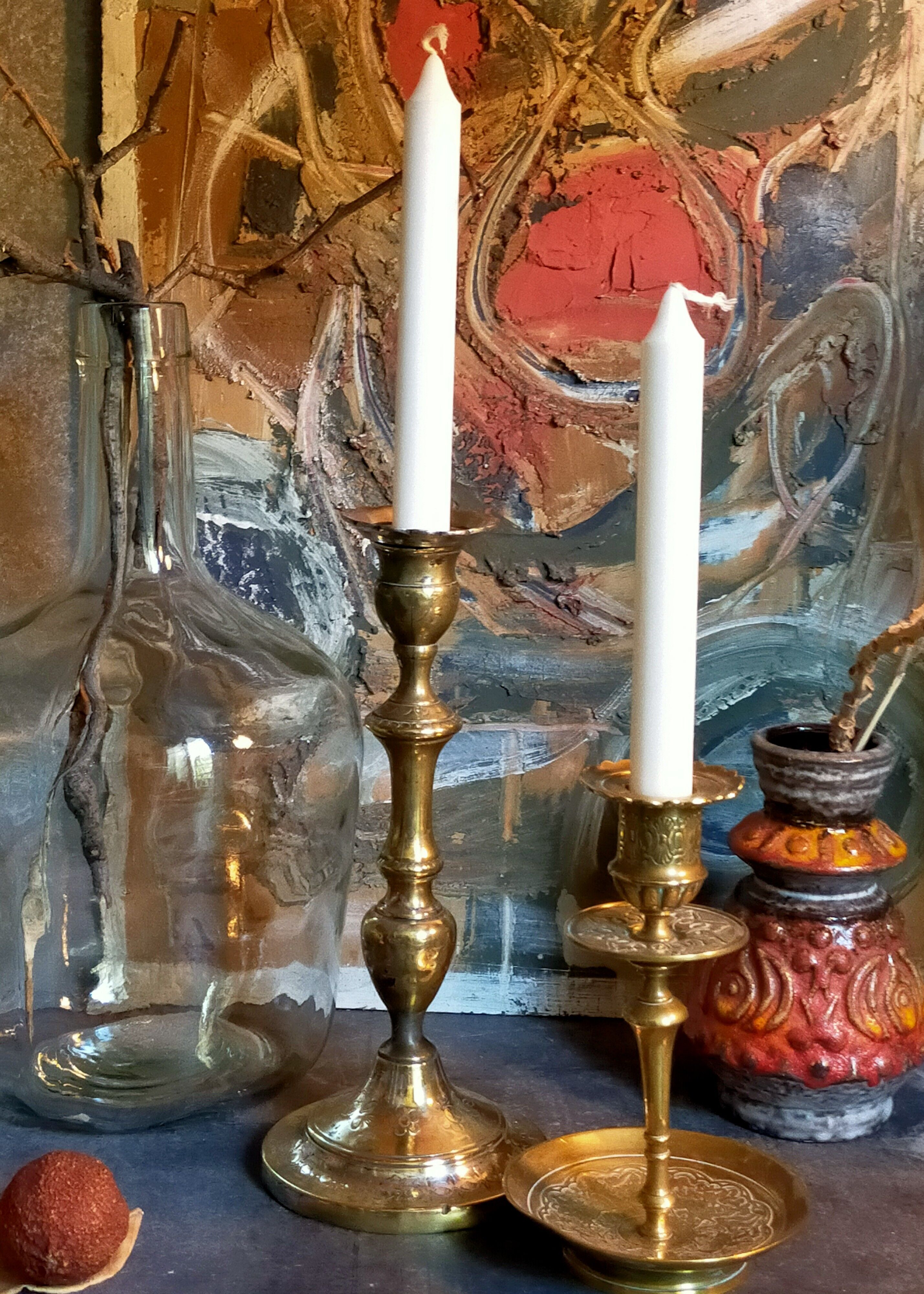 Duo of solid brass and gold metal candle holders worked old