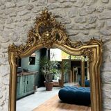 Antique mirror 169/105cm with pediments and pearl detailing in gold leaf.