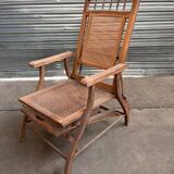 Vintage wooden and cane chaise longue