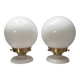 Pair of wall sconces with white opaline globes