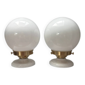 Pair of wall sconces with white opaline globes