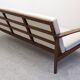 Scandinavian style three-seater sofa in teak, France circa 1950.