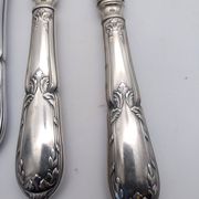 Set of 12 sfam knives in silver metal and stainless steel blades.