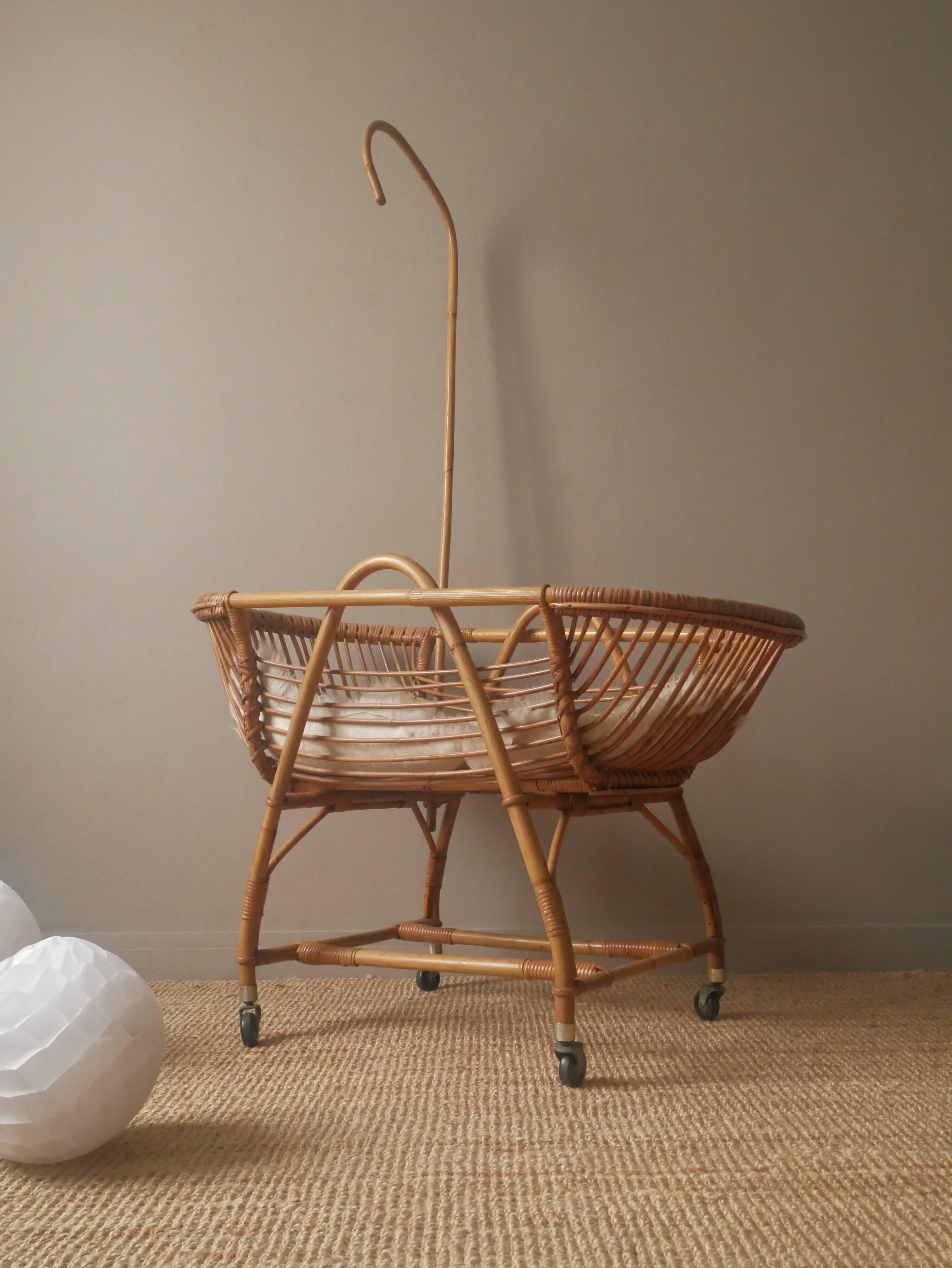 Vintage rattan cradle bassinet on wheels retro Scandinavian design baby bed
