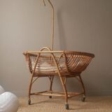Vintage rattan cradle bassinet on wheels retro Scandinavian design baby bed