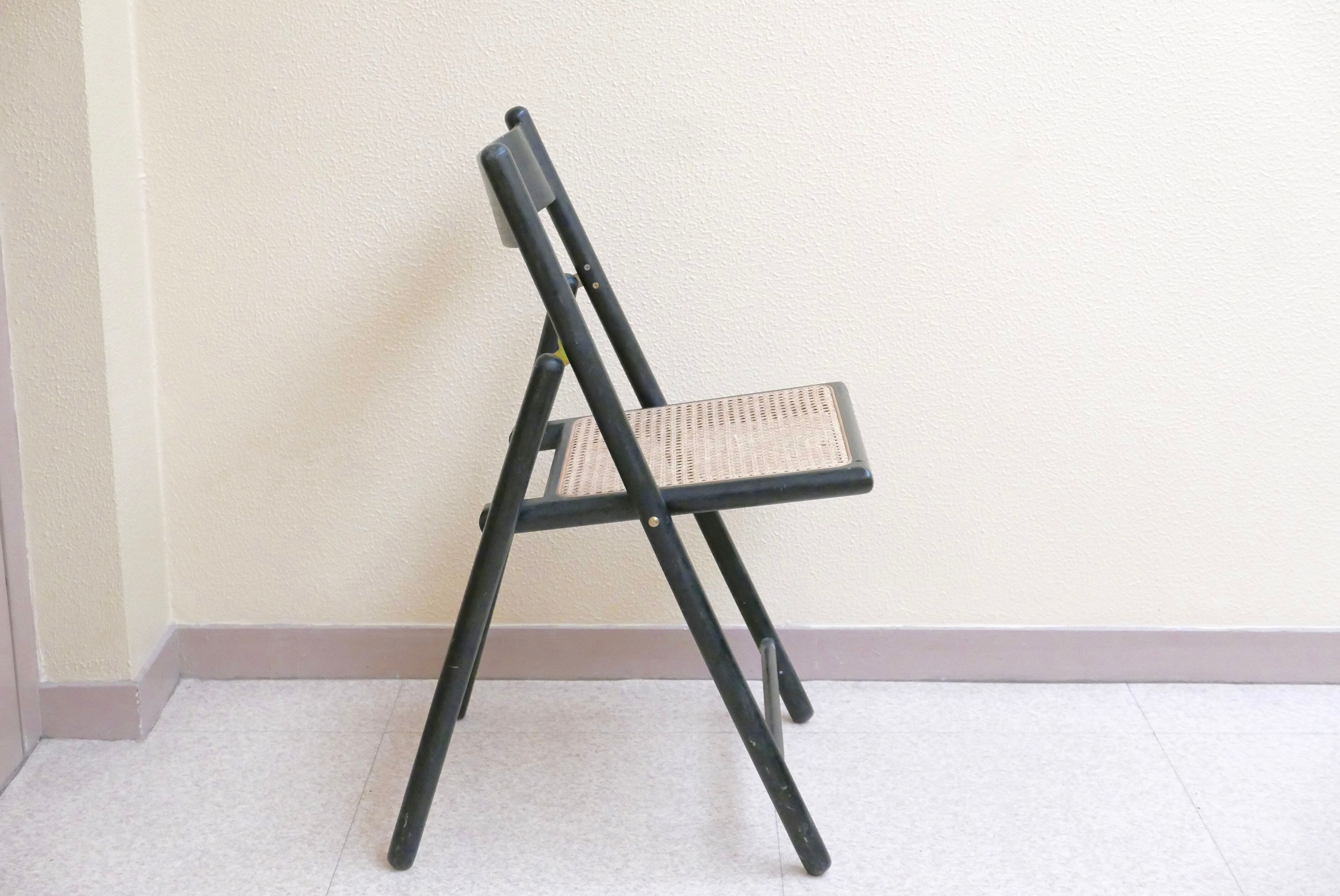 Black folding chair, 70s