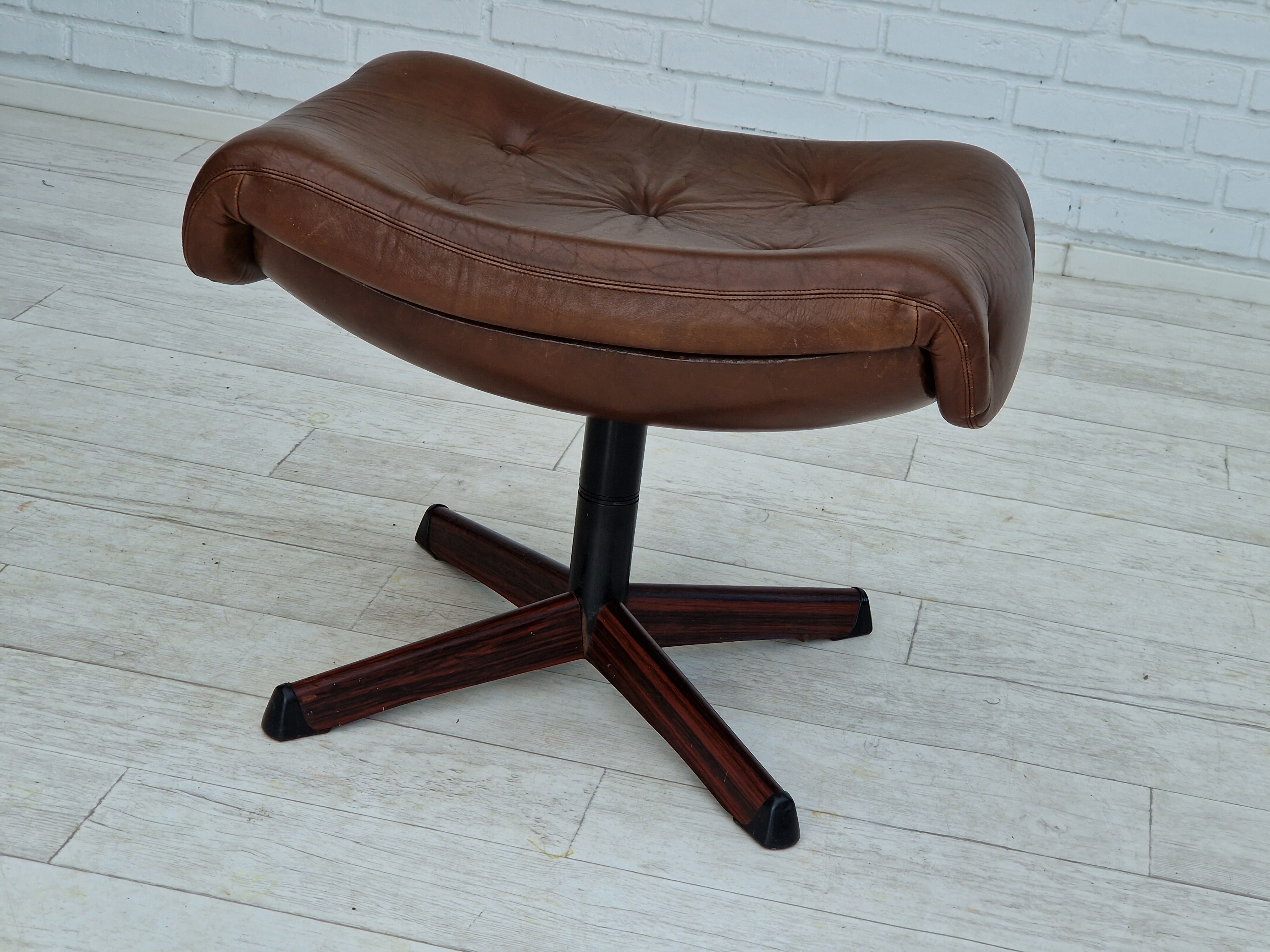 1970s, Swedish design by Göte Möbler Nässjö, swivel footstool in brown leather.