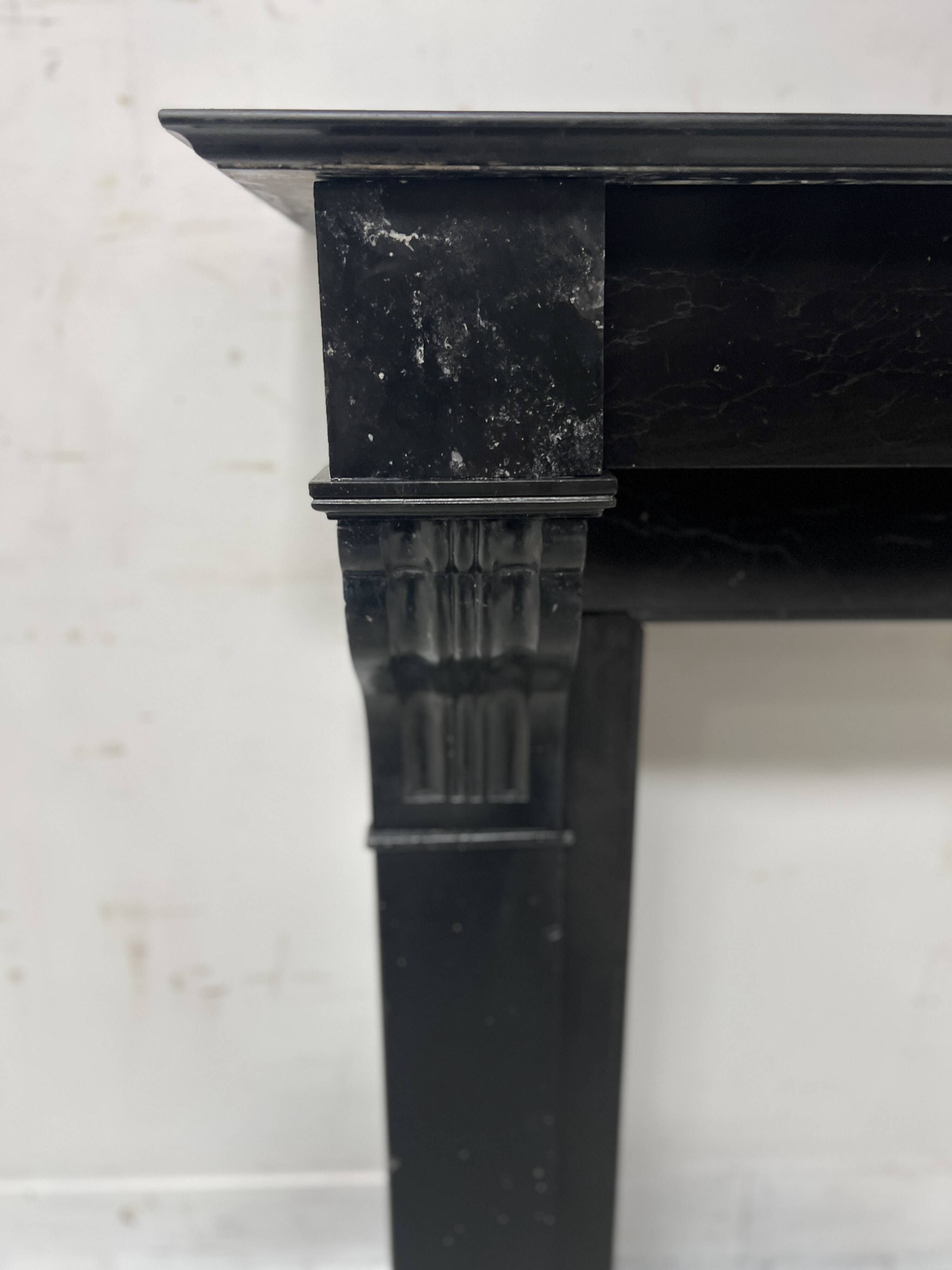 Napoleon III period fireplace with a black marble corbel. 19th century.