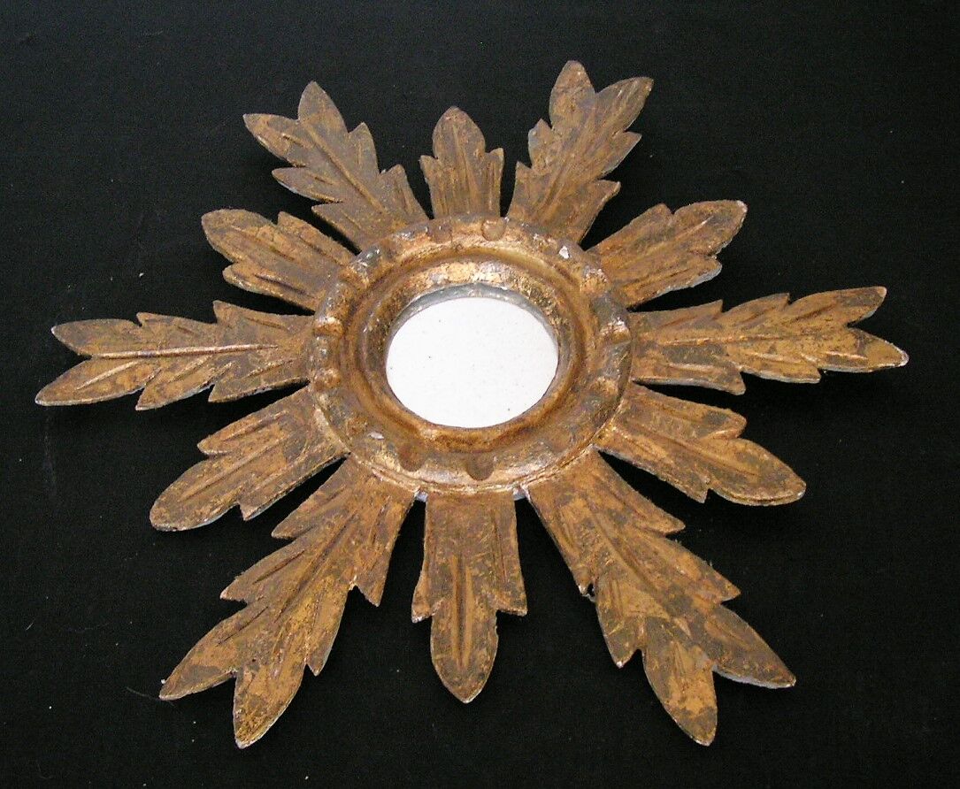 Sun mirror in gilded wood