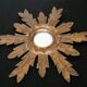 Sun mirror in gilded wood