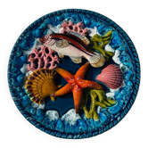 Assiette barbotine décor marin en relief