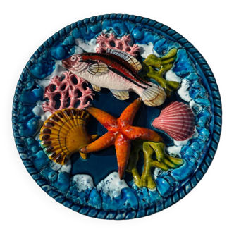 Barbotine plate with marine relief decoration