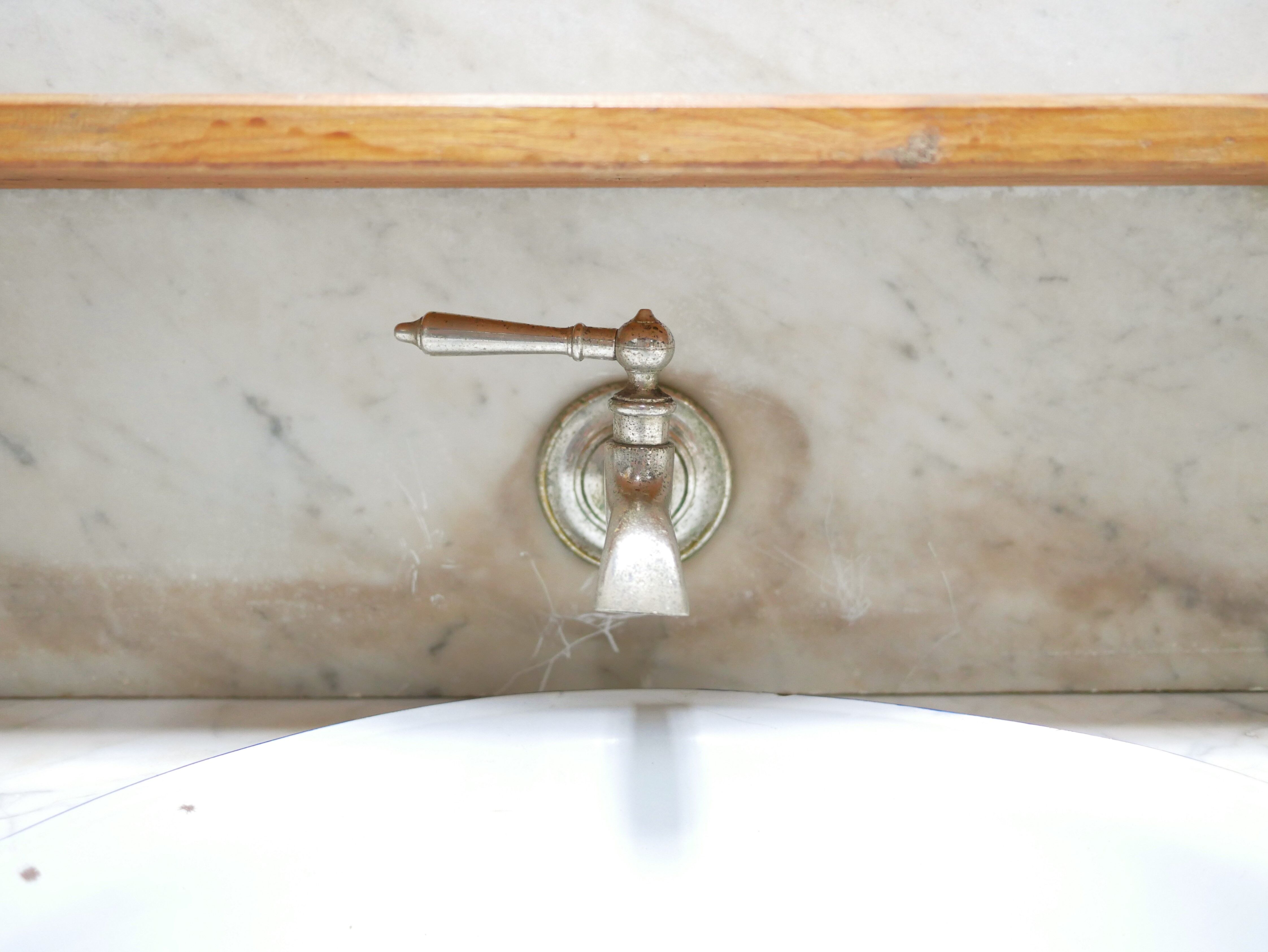 Antique washbasin cabinet in marble and wood