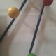 Wall-mounted coat rack with colored balls