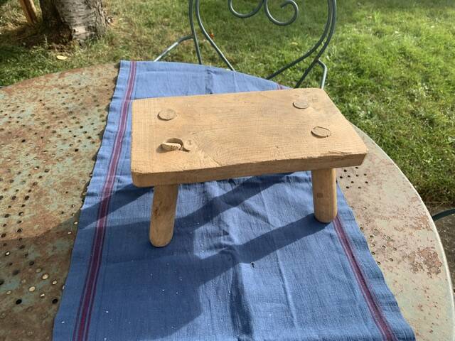 Small bench, footrest in artisanal raw wood