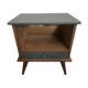 Renovated vintage bedside table in wood, with tapered legs – Matt green & gold background