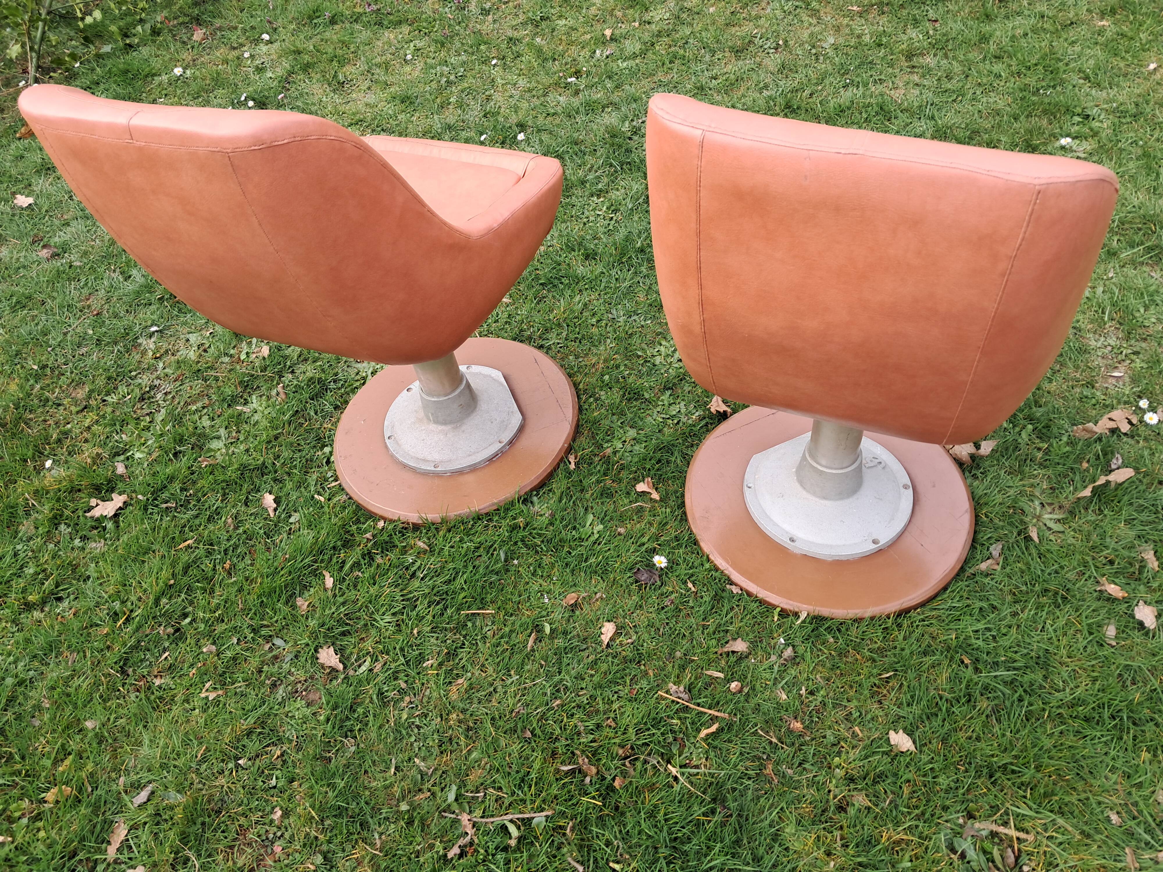 Original armchair on a cast iron base.