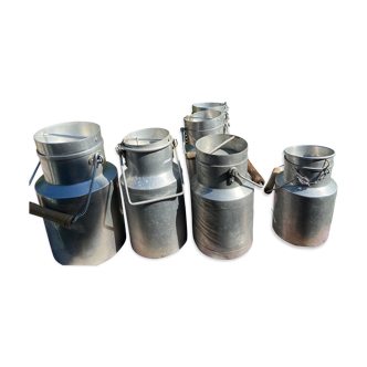 Lot of 4 cans of aluminum milk